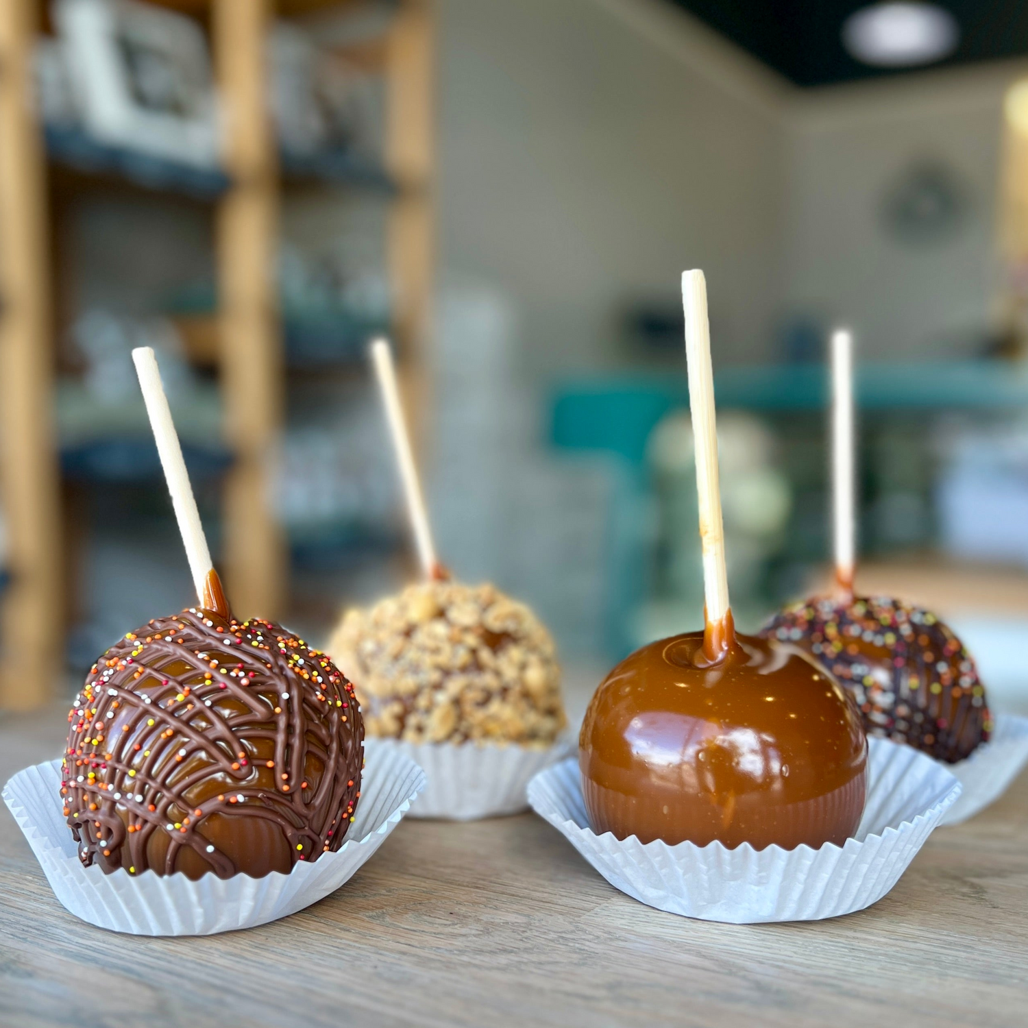 four caramel apples