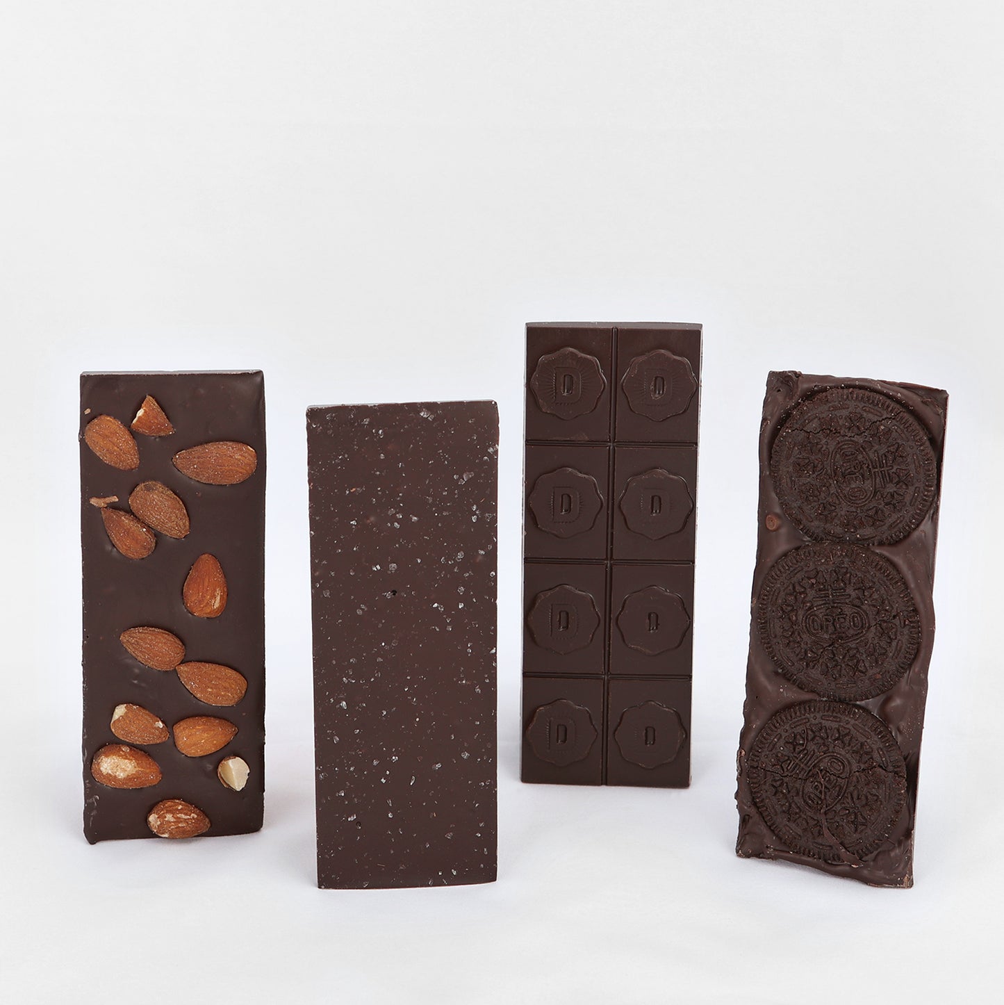 Four dairy-less Deiter's chocolate bars, almond, sea salt, plain and cookie