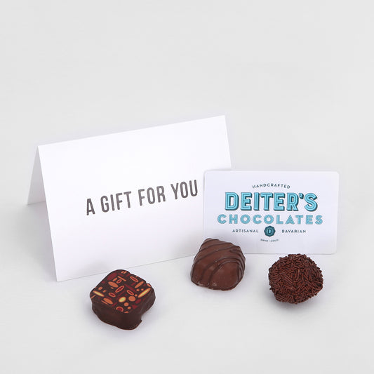 a plastic Deiter's gift card, envelope and three truffles