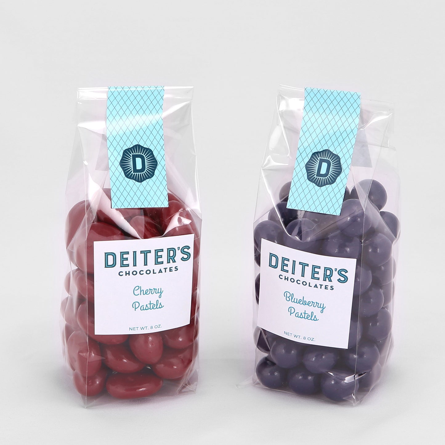 bags of cherry and blueberry pastel candies.